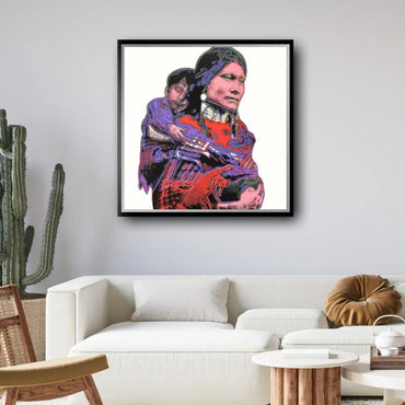 Framed artwork of a woman holding a child on a wall above a white sofa.