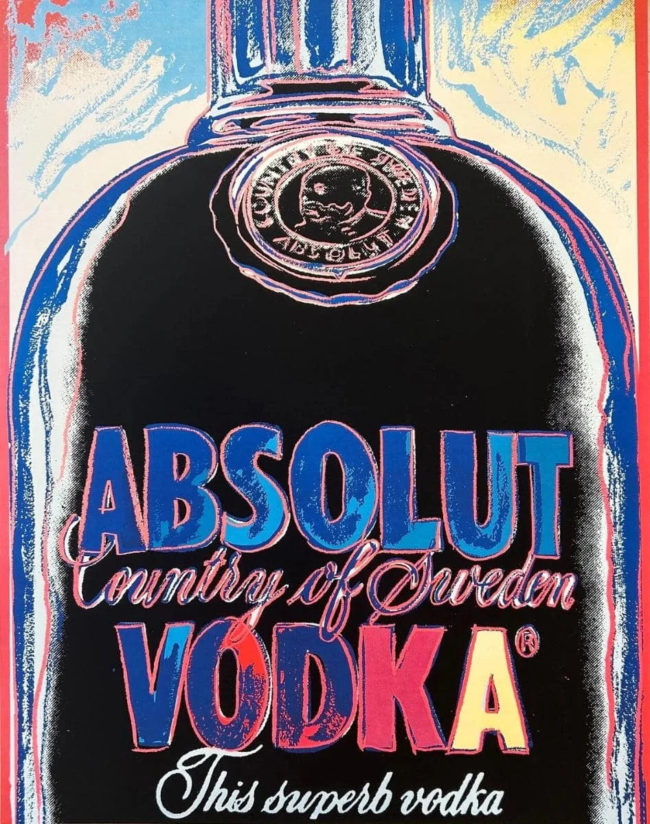 Absolut Vodka bottle with colorful label on a blue background