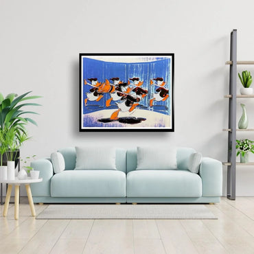 Framed artwork of cartoon Donald Duck on a wall above a light blue sofa.