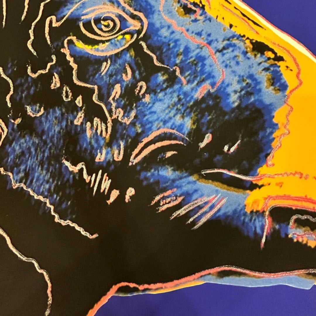 Abstract artwork with blue, black, and orange colors on a dark background