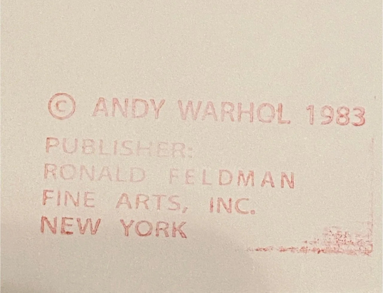 Text attribution to Andy Warhol and Ronald Feldman Fine Arts, Inc. on a beige background