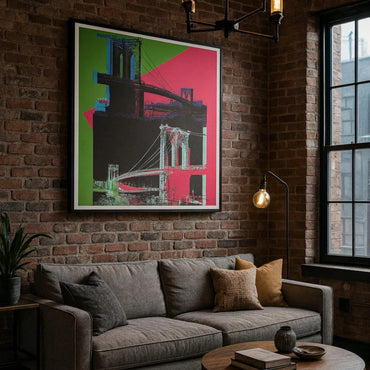 Apartment Living room with a gray sofa, colorful abstract art of the brooklyn bridge on brick wall, and a window.