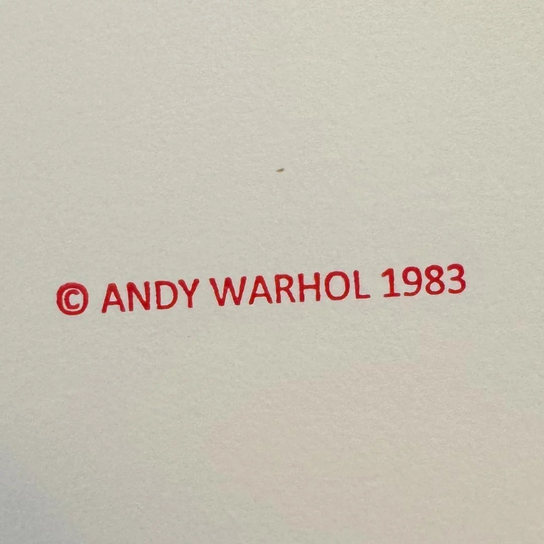 Red text '© ANDY WARHOL 1983' on a beige background