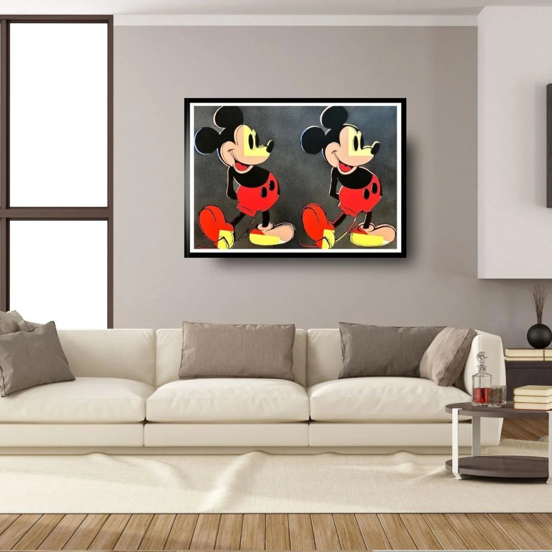 Framed artwork of a cartoon character on a wall above a sofa in a living room.