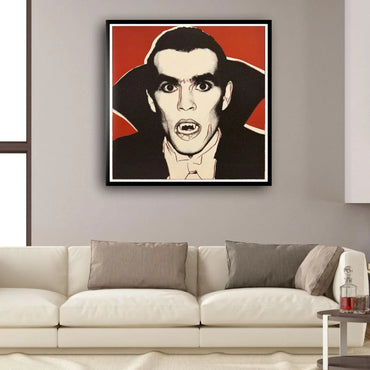 Framed artwork of a Dracula character with a red background above a beige sofa.