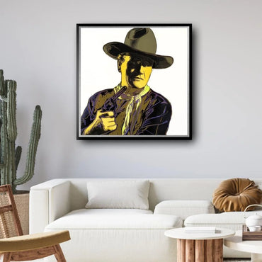 Framed artwork of a cowboy on the wall above a white sofa in a living room.