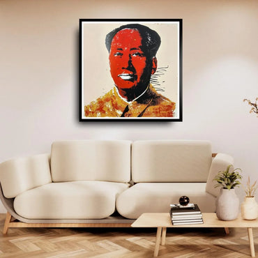 Framed artwork of a historical figure above a beige sofa in a living room.