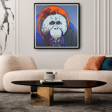 Modern living room with a beige sofa, coffee table, and abstract painting on the wall.