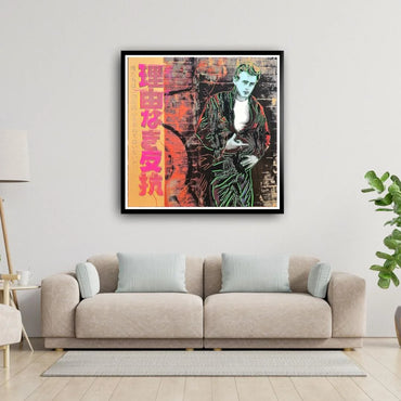 Framed artwork of a character with colorful design on a wall above a beige sofa.