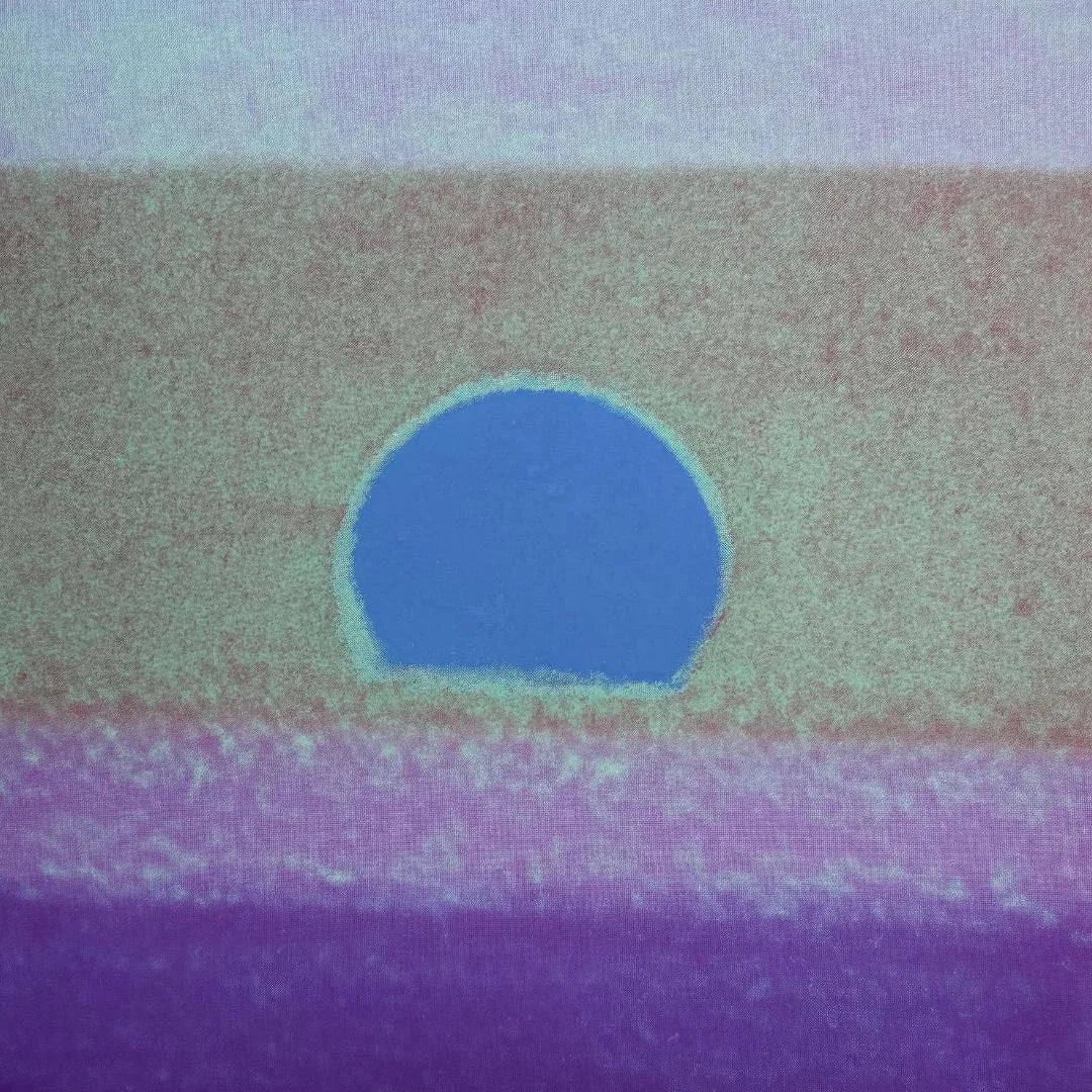 Abstract art with a blue circle on a multicolored background