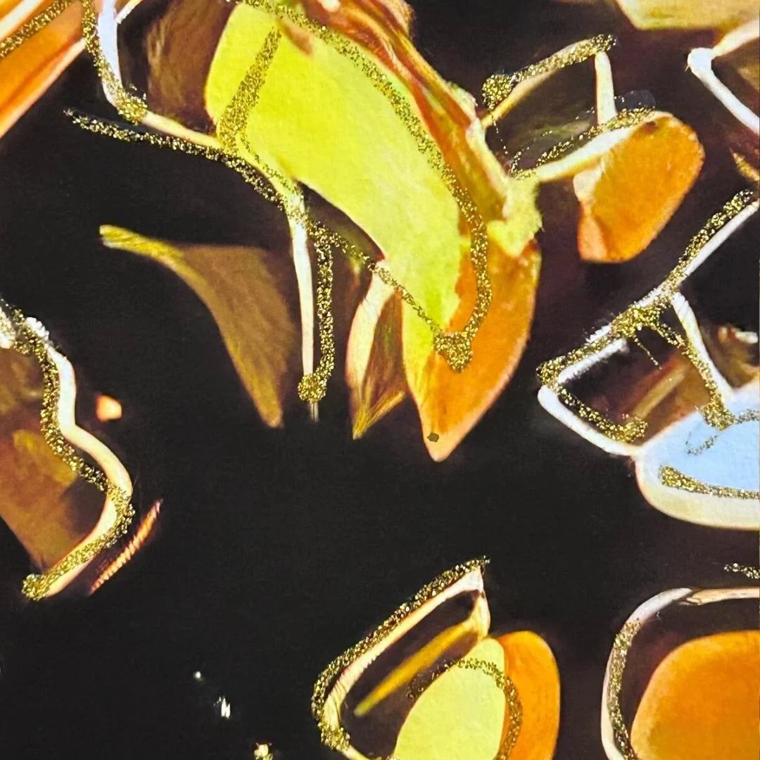 Close-up of decorative items with gold accents on a dark background