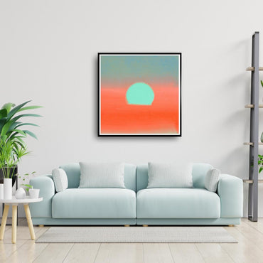 Modern living room with a light blue sofa, a plant, and a framed abstract artwork on the wall.
