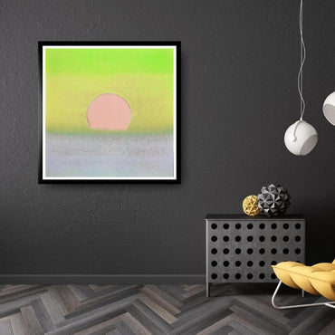 Framed abstract artwork on a dark wall with modern decor elements.