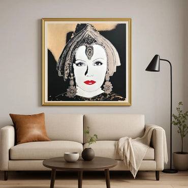 Living room with a beige sofa, round wooden coffee table, and a large framed artwork on the wall.