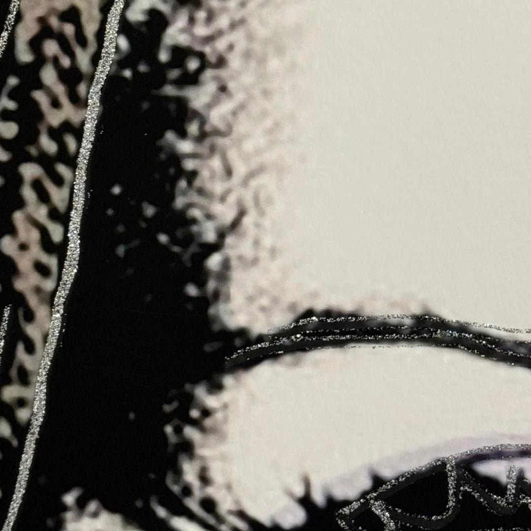 Close-up of a textured surface with patterns and a circular design.