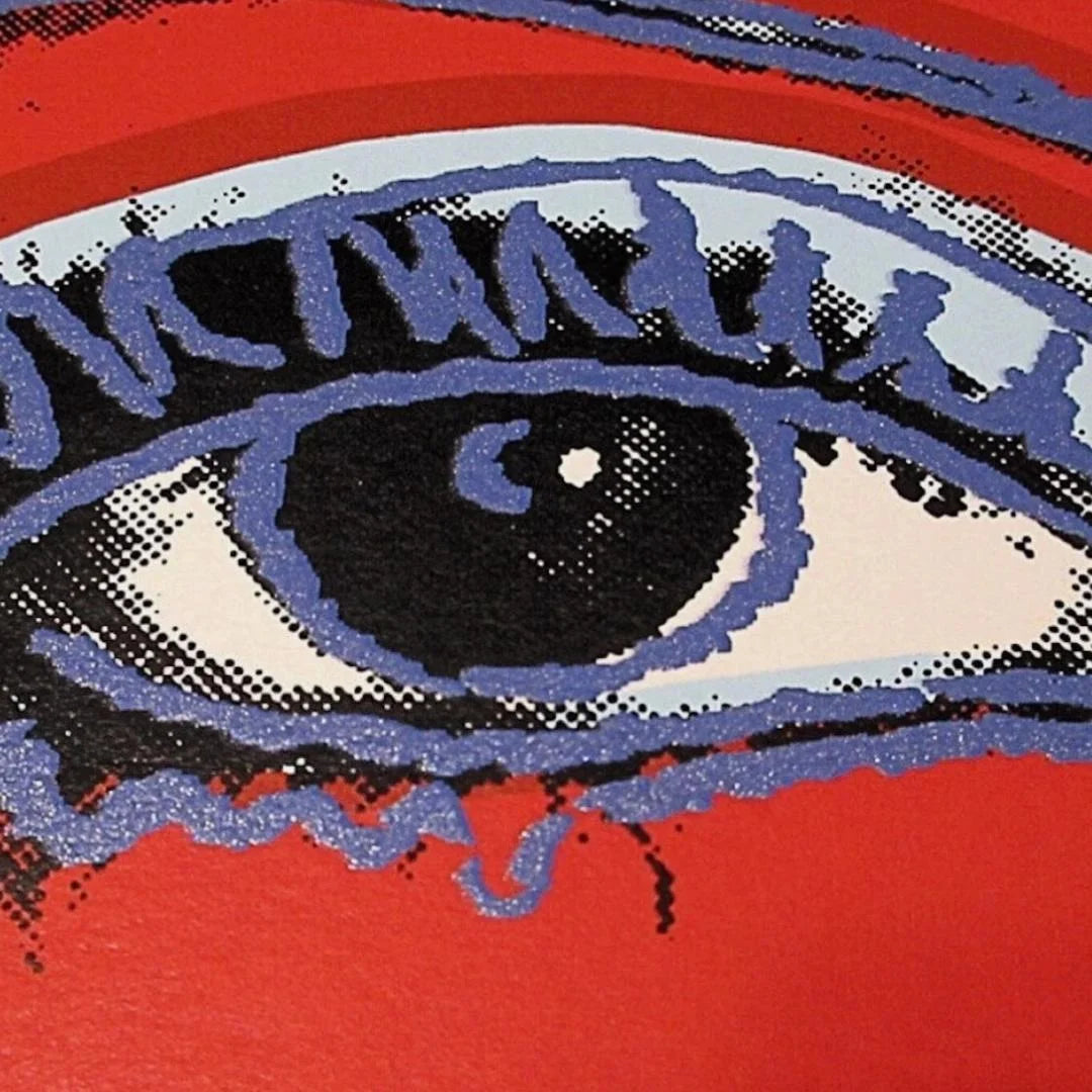Illustration of a stylized eye with red and blue accents on a red background