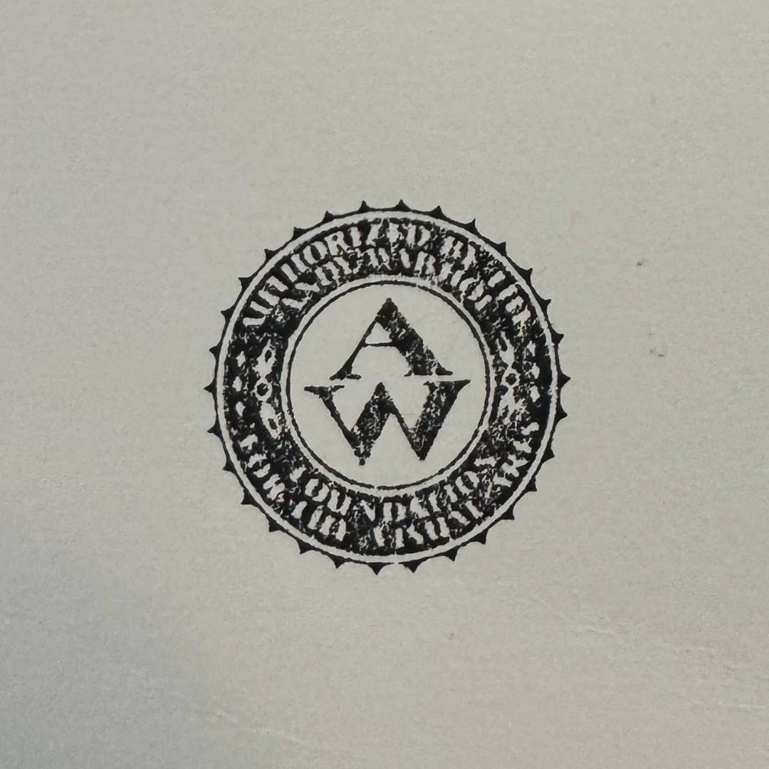 Circular logo with text and design elements on a light gray background