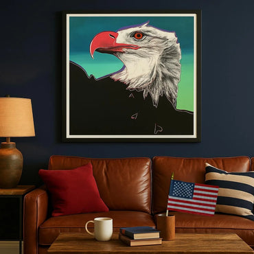 Framed artwork of an eagle above a brown leather sofa with decorative pillows and a small American flag.