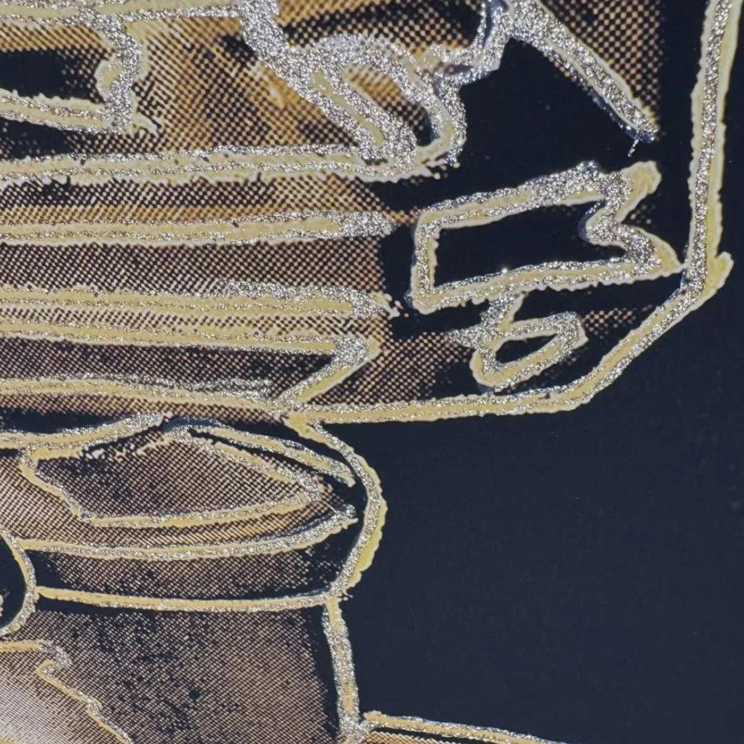 Decorative design with gold and black elements on a dark background