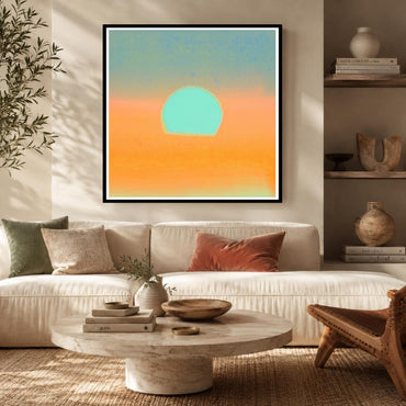 Living room with a white sofa, round wooden coffee table, and abstract sunset painting on the wall.