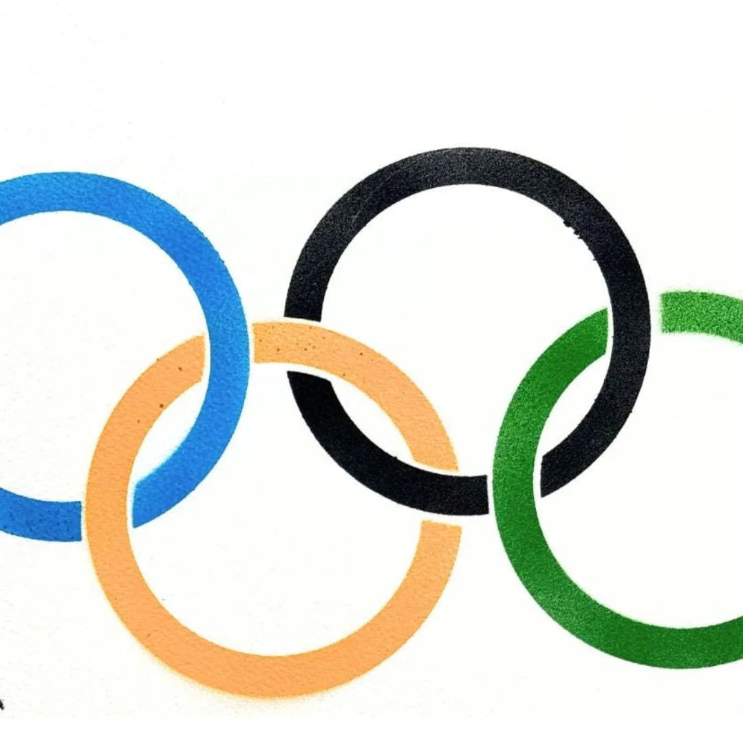 Olympic rings in blue, orange, black, and green on a white background spray painting.