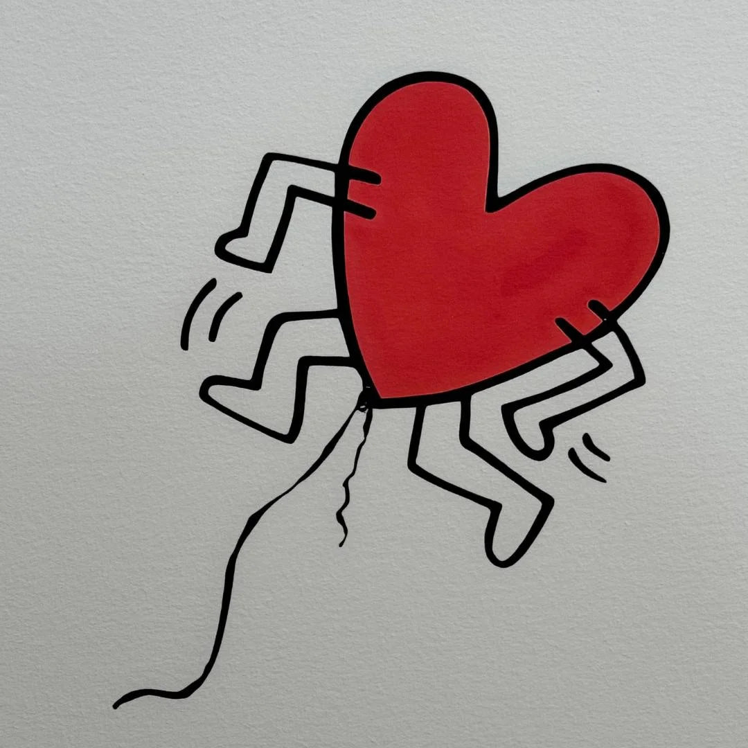 Red heart with legs and arms on a gray background