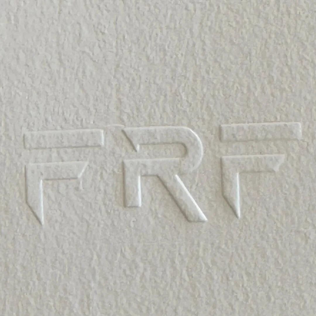 Embossed logo on textured white paper