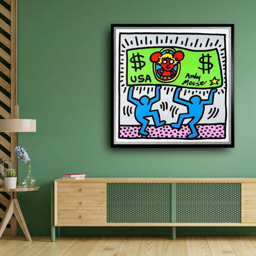 Framed artwork of a colorful cartoon character on money with two blue figures, hanging above a wooden cabinet against a green wall.