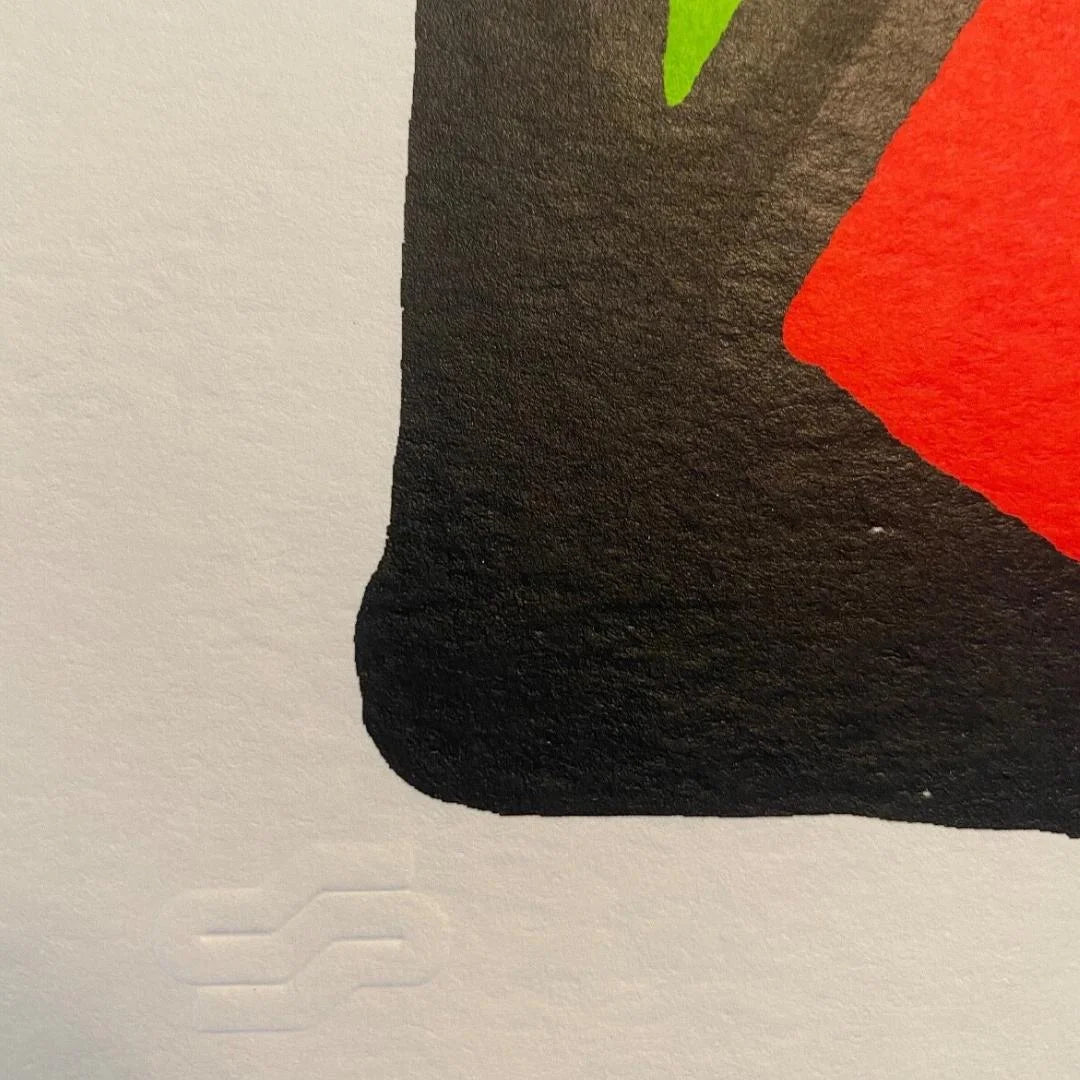 Close-up of a embossed publisher logo and the high quality silkscreen print.