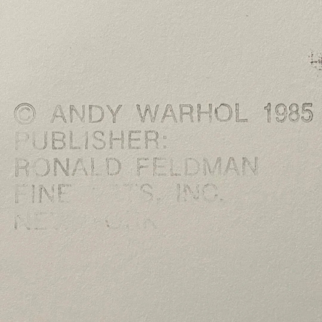 Text attribution to Andy Warhol and Ronald Feldman Fine Arts Inc. on a beige background