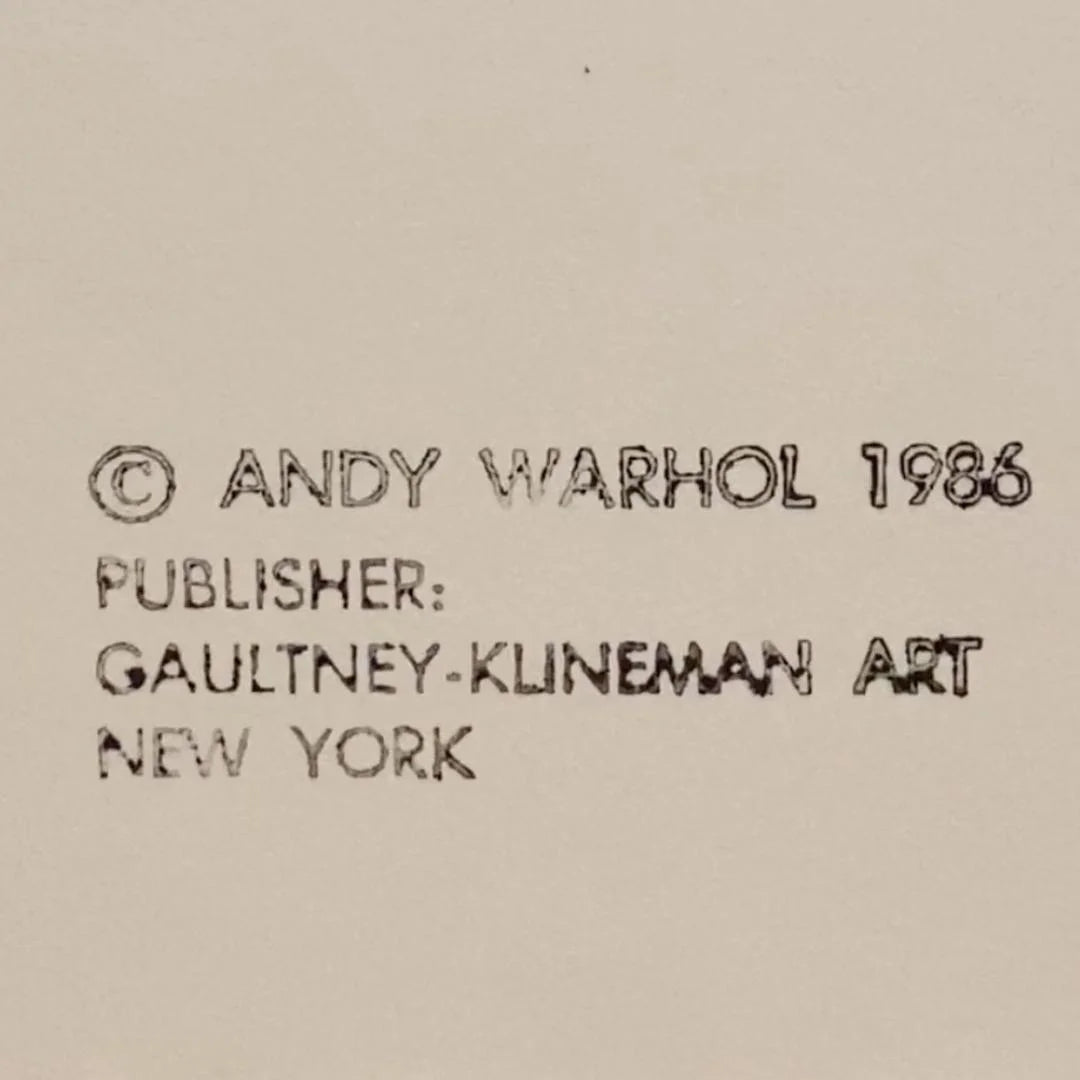 Text attribution to Andy Warhol with a publisher name on a beige background