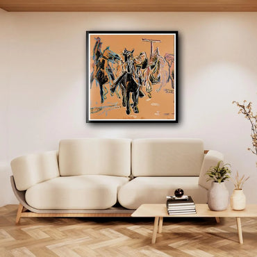 Framed abstract artwork above a beige sofa in a living room setting.