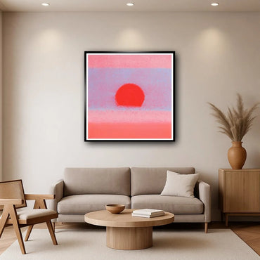 Modern living room with a gray sofa, wooden coffee table, and abstract art on the wall.