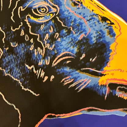 Abstract artwork with blue, black, and orange colors on a dark background