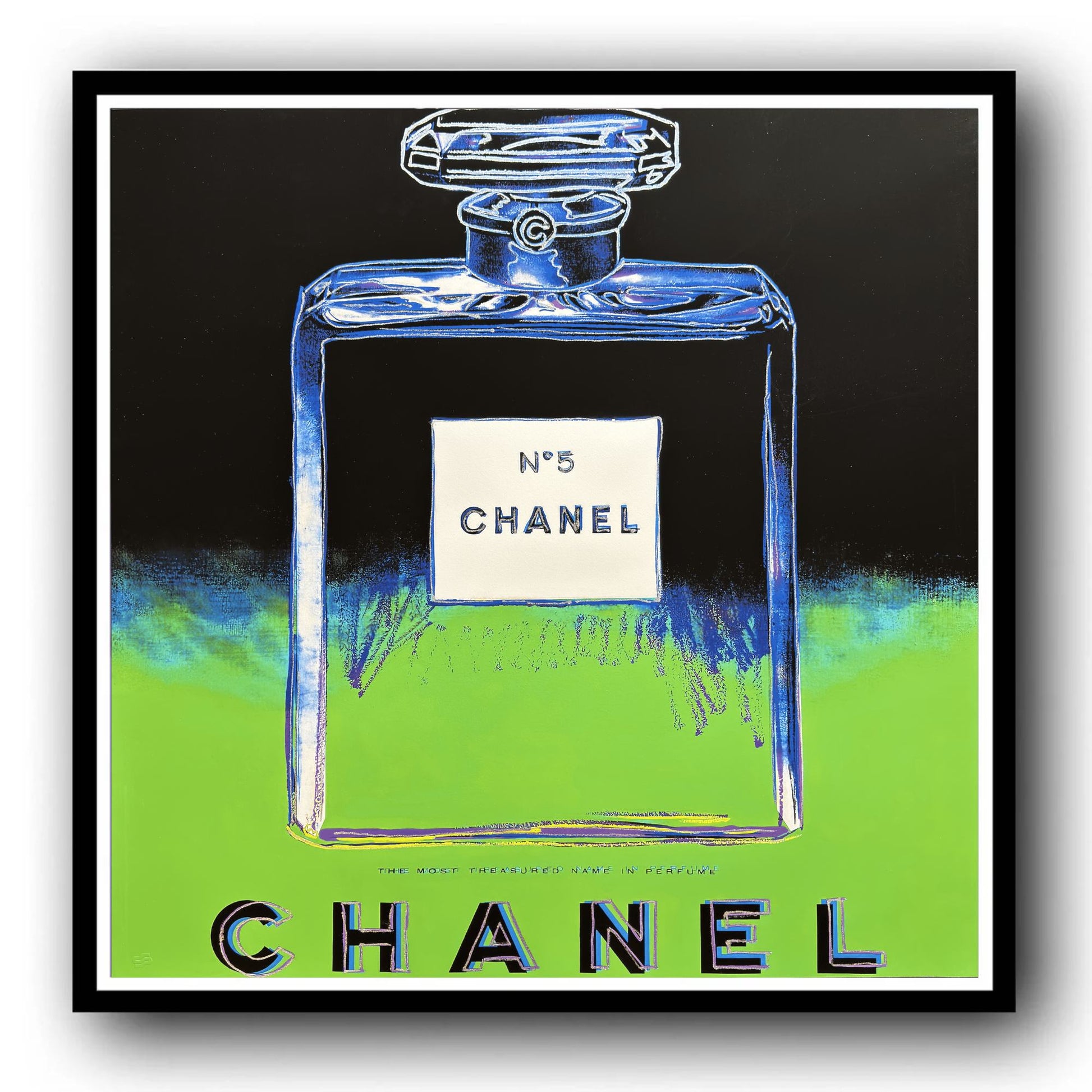 Framed artwork of a Chanel No. 5 perfume bottle with a colorful abstract design.