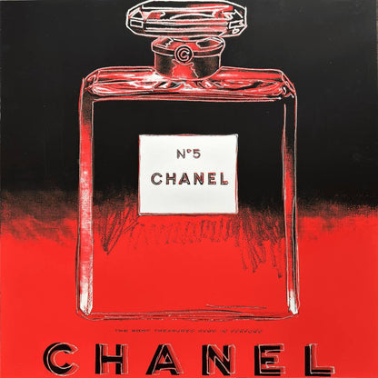 Red Chanel No. 5 perfume bottle with black background