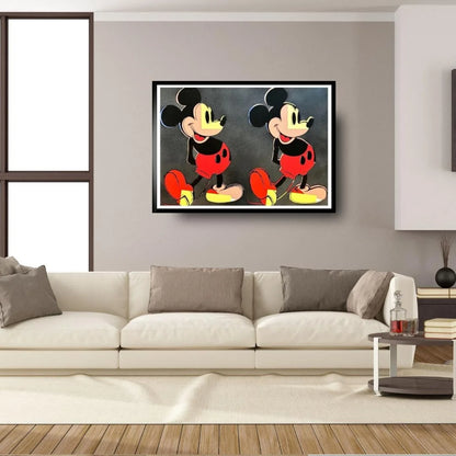 Framed artwork of a cartoon character on a wall above a sofa in a living room.