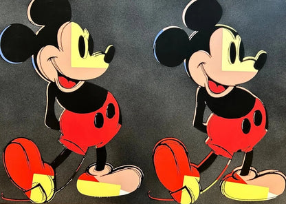 Two identical cartoon characters with red shorts and yellow shoes on a dark background