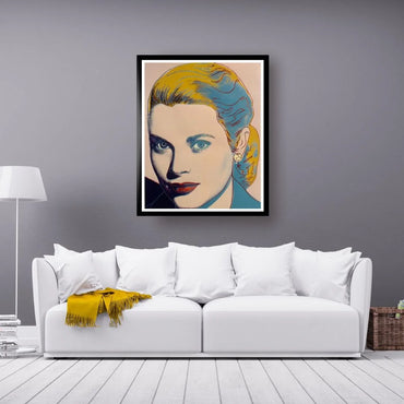 Framed portrait above a white sofa with a yellow blanket in a living room setting.