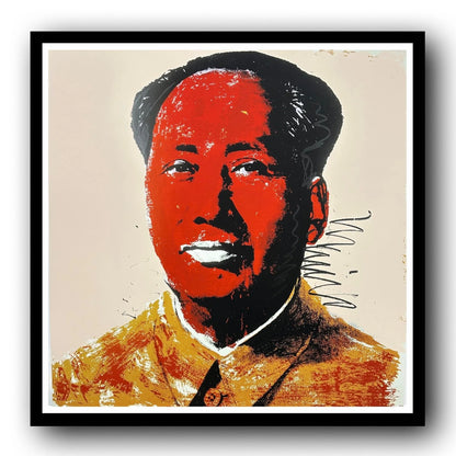 Framed artwork of a stylized portrait with bold red and black colors on a beige background