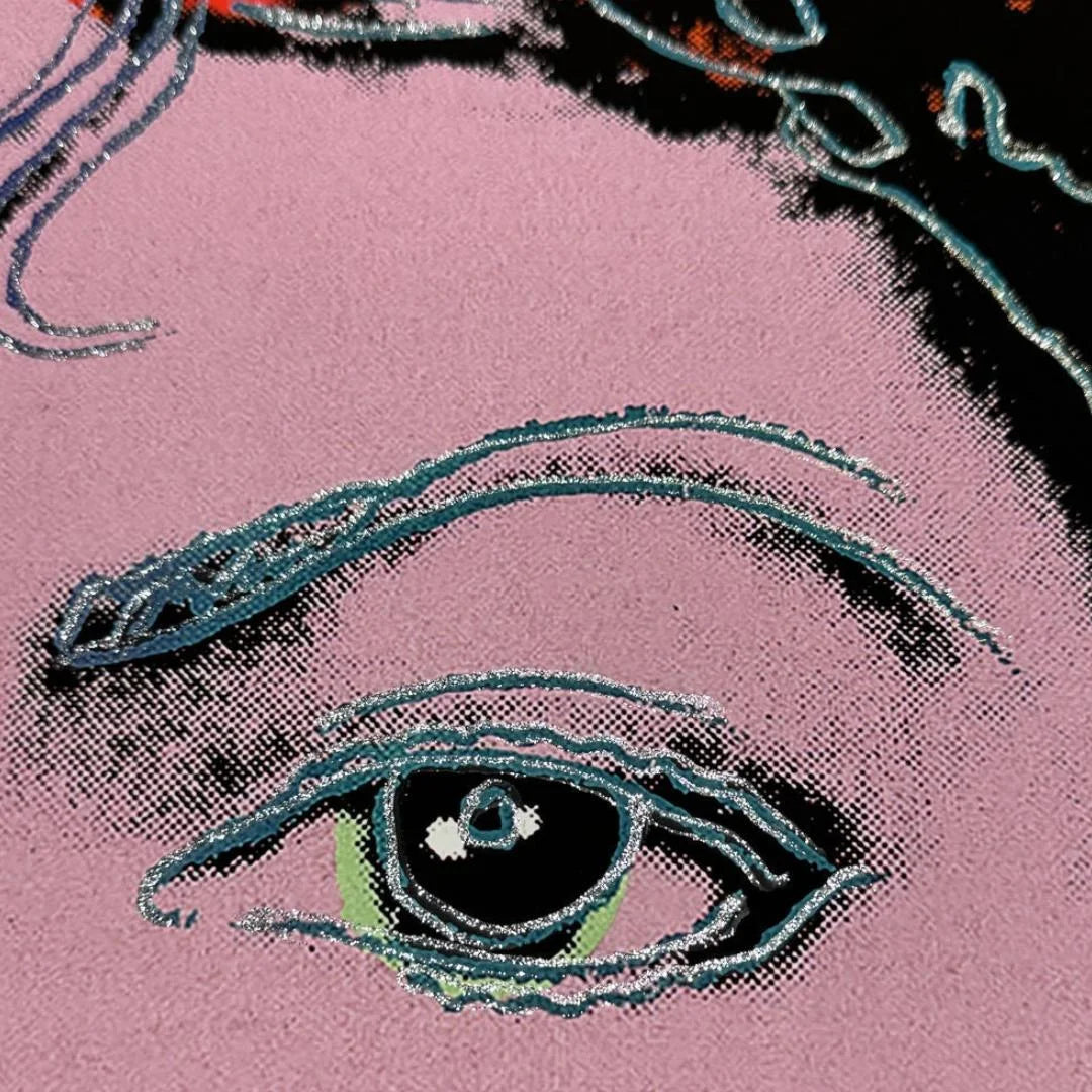 Close-up of a stylized eye with intricate detailing on a pink background