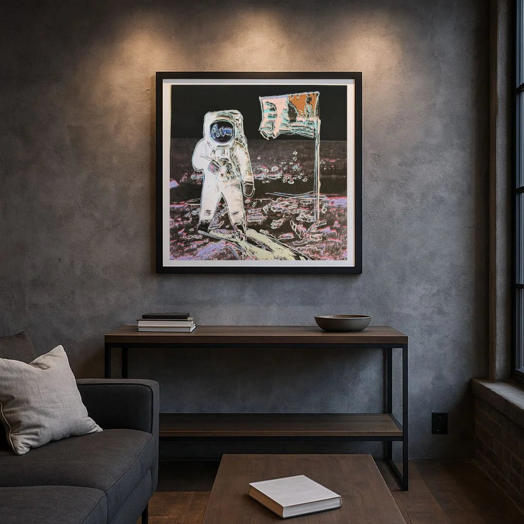 Living room with an astronaut painting on the wall, a sofa, and a coffee table.