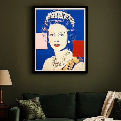 Framed artwork of a stylized portrait on a dark wall above a sofa.
