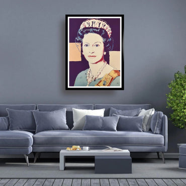 Framed portrait of a Queen Elizabeth pop art style on a wall above a gray sofa in a living room.