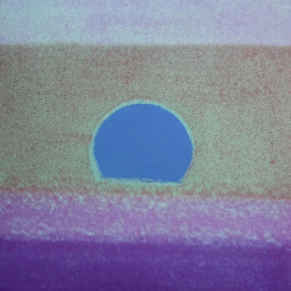 Abstract art with a blue circle on a multicolored background