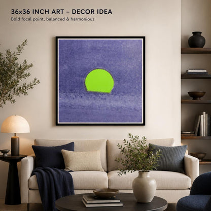 Framed abstract art with a green circle on a blue background in a living room setting.