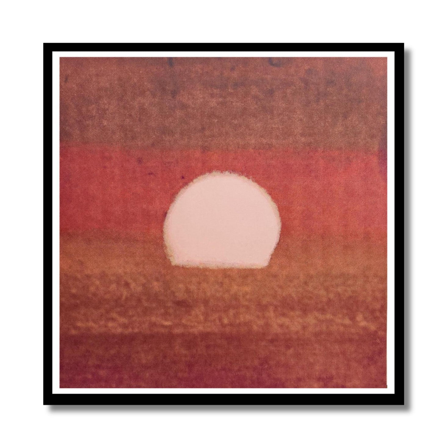 Framed artwork of a sunset with a white circle in the center, set against a red and brown gradient background.