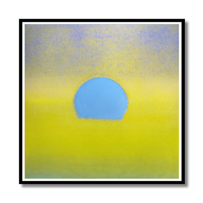 Abstract square wall art featuring a soft yellow field with a central light blue oval shape, presented in a black frame with a white mat against a white background.