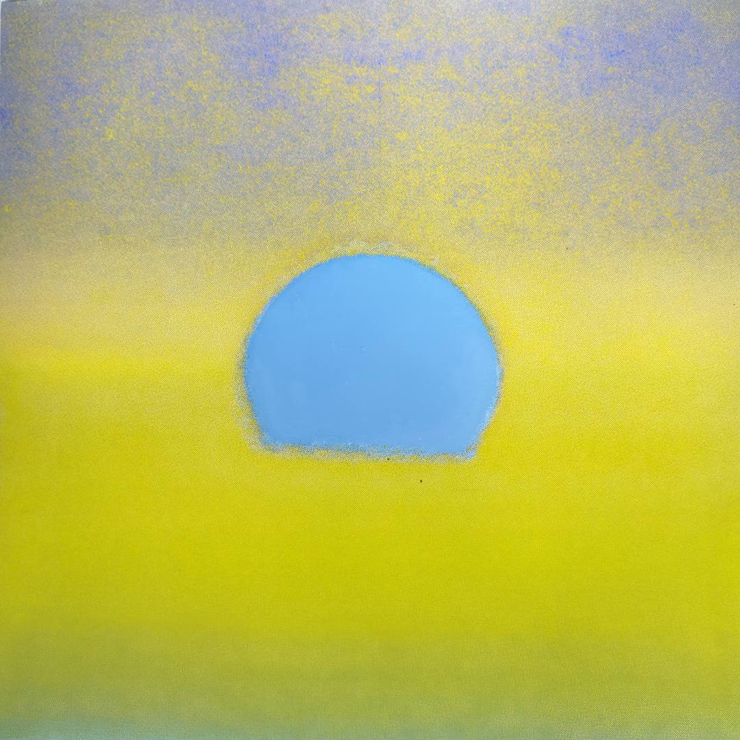 Abstract pastel artwork featuring a central light blue oval shape on a bright yellow background with a soft lavender-blue textured area at the top.