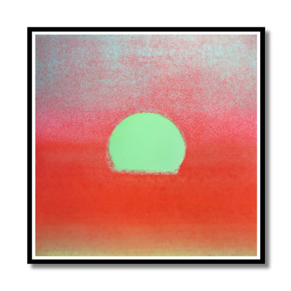 Abstract square wall art featuring a mint green sun or circle centered against a textured red-to-pink gradient sky, presented in a black frame with a white mat on a light gray background.